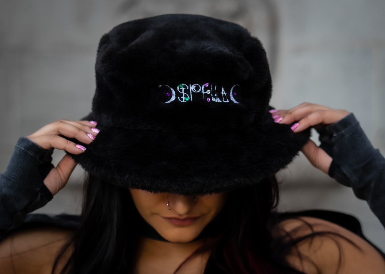 Spella Wearing a Spella Black Fluffy Bucket Hat